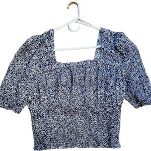 Blue and white floral blouse, ribbed bottom, elbow length sleeve